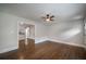 Living room showcasing beautiful hardwood floors, a ceiling fan, and lots of natural light at 2137 Delowe Dr, Atlanta, GA 30344