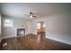 Living room showcasing beautiful hardwood floors, a decorative fireplace, and a ceiling fan at 2137 Delowe Dr, Atlanta, GA 30344