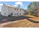 Expansive backyard featuring a traditional two-story home with a private outdoor space, perfect for entertaining at 221 Cutbank Sw Ct, Atlanta, GA 30331