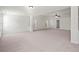 Large bonus room features plush carpeting, neutral walls, lots of natural light, and a ceiling fan at 221 Cutbank Sw Ct, Atlanta, GA 30331