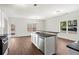 Open kitchen includes stainless appliances, granite countertops, and an eat-in area with natural light at 221 Cutbank Sw Ct, Atlanta, GA 30331