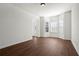 Inviting living room features new hardwood floors, recessed lighting, and bright bay windows at 221 Cutbank Sw Ct, Atlanta, GA 30331