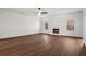 Spacious living room features new hardwood floors, fireplace, recessed lighting, and bright windows at 221 Cutbank Sw Ct, Atlanta, GA 30331