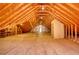 Large attic with exposed beams, wooden floor, and a storage closet, providing ample space for storage or customization at 3601 Club Nw Dr, Kennesaw, GA 30144