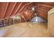 Large attic with exposed beams and storage shelves at 3601 Club Nw Dr, Kennesaw, GA 30144