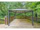 Wooden back deck featuring a gazebo overlooking the surrounding trees at 3601 Club Nw Dr, Kennesaw, GA 30144