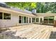 Spacious wooden deck outside the house with some trees nearby and room for activities at 3601 Club Nw Dr, Kennesaw, GA 30144