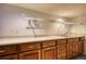 Wide shot of the unfinished basement, showing the long countertop, sink, drawers and shelving at 3601 Club Nw Dr, Kennesaw, GA 30144