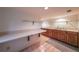 Basement bar area featuring a counter with wooden cabinets and tile flooring at 3601 Club Nw Dr, Kennesaw, GA 30144