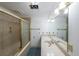 Bathroom featuring a shower tub and large vanity mirror at 3601 Club Nw Dr, Kennesaw, GA 30144