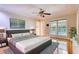 Bright bedroom with hardwood floors, ceiling fan, and natural light at 3601 Club Nw Dr, Kennesaw, GA 30144