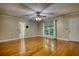Bedroom features hardwood floors, ceiling fan, and an ensuite bathroom at 3601 Club Nw Dr, Kennesaw, GA 30144