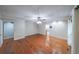 Bright bedroom boasts hardwood floors, a ceiling fan, and ample space for versatile furniture arrangements at 3601 Club Nw Dr, Kennesaw, GA 30144