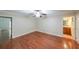 Spacious bedroom featuring hardwood floors, neutral walls, and a ceiling fan at 3601 Club Nw Dr, Kennesaw, GA 30144
