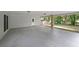 A large carport with a concrete floor and multiple access doors provides covered parking at 3601 Club Nw Dr, Kennesaw, GA 30144