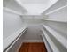 Walk-in closet with multiple shelves and hardwood flooring at 3601 Club Nw Dr, Kennesaw, GA 30144