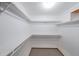 Walk-in closet with carpet and multiple shelves at 3601 Club Nw Dr, Kennesaw, GA 30144