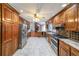Open kitchen with stainless steel appliances flowing into a living space and offering a seamless living experience at 3601 Club Nw Dr, Kennesaw, GA 30144