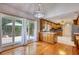 Eat-in kitchen with granite counters, wood cabinets, stainless appliances, and a view of the deck at 3601 Club Nw Dr, Kennesaw, GA 30144