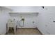 Laundry room equipped with a sink, shelving, and cabinet storage at 3601 Club Nw Dr, Kennesaw, GA 30144