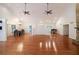 Spacious living room with hardwood floors, ceiling fans, and a view to the dining room at 3601 Club Nw Dr, Kennesaw, GA 30144