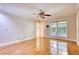 Sun-filled living room features hardwood floors, a ceiling fan and a window with view of the outdoors at 3601 Club Nw Dr, Kennesaw, GA 30144