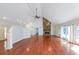 Bright living room featuring hardwood floors and a stone fireplace at 3601 Club Nw Dr, Kennesaw, GA 30144
