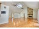 Spacious living room featuring hardwood floors, a stone fireplace, vaulted ceilings and entry way at 3601 Club Nw Dr, Kennesaw, GA 30144