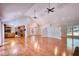 Open living area with hardwood floors, fireplace, vaulted ceiling, and views of kitchen at 3601 Club Nw Dr, Kennesaw, GA 30144