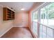 Versatile room with large windows offering natural light, built-in shelving, and neutral walls at 3601 Club Nw Dr, Kennesaw, GA 30144