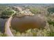 Aerial view showcasing a lake surrounded by lush greenery and community amenities at 422 Murphy Avenue, Canton, GA 30114