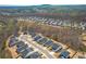 Wide aerial view showcasing a neighborhood nestled in a beautiful, wooded area at 422 Murphy Avenue, Canton, GA 30114