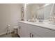 Modern bathroom featuring a double sink vanity, white cabinetry, and tile flooring at 422 Murphy Avenue, Canton, GA 30114