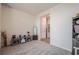 This living area has a cabinet, lamp, and beige colored carpet at 422 Murphy Avenue, Canton, GA 30114