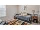 Comfortable bedroom with daybed, unique rug, and vintage radio at 422 Murphy Avenue, Canton, GA 30114