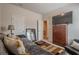 Cozy bedroom featuring a futon, television, and a decorative mirror at 422 Murphy Avenue, Canton, GA 30114