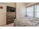Comfortable bedroom featuring a large dresser with television, and a neutral color palette at 422 Murphy Avenue, Canton, GA 30114