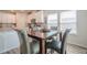 Cozy dining area adjacent to kitchen, showcasing views through bright windows at 422 Murphy Avenue, Canton, GA 30114