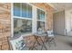 Inviting front porch with stone accents and seating, offering a cozy spot to relax outdoors at 422 Murphy Avenue, Canton, GA 30114