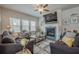 Comfortable living room with a fireplace, large windows, and stylish decor at 422 Murphy Avenue, Canton, GA 30114