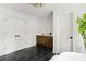 Large bathroom featuring dark tiled floor, wood vanity, and a soaking tub at 1155 Peachtree Battle Nw Ave, Atlanta, GA 30327