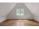 Bright bedroom featuring hardwood floors, vaulted ceiling and a double window allowing plenty of natural light at 1155 Peachtree Battle Nw Ave, Atlanta, GA 30327