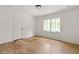 Bright bedroom with hardwood floors, white trim and large window providing plenty of natural light at 1155 Peachtree Battle Nw Ave, Atlanta, GA 30327