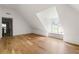 Upstairs bedroom with hardwood floors and a window seat beneath the window at 1155 Peachtree Battle Nw Ave, Atlanta, GA 30327