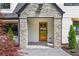 Charming front entrance with stone accents and a wooden door at 1155 Peachtree Battle Nw Ave, Atlanta, GA 30327