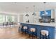 Bright kitchen with a large island, pendant lighting, and an adjacent dining area at 1155 Peachtree Battle Nw Ave, Atlanta, GA 30327