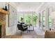 Bright living room with stone fireplace, modern furniture, large windows, and natural light at 1155 Peachtree Battle Nw Ave, Atlanta, GA 30327