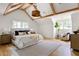 Lovely main bedroom showcasing wooden beams and light fixture, sitting area, hardwood floors and large double window at 1155 Peachtree Battle Nw Ave, Atlanta, GA 30327