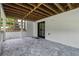Covered patio featuring stone pavers and a whitewashed brick wall, perfect for outdoor enjoyment at 1155 Peachtree Battle Nw Ave, Atlanta, GA 30327
