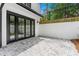 A beautifully paved patio area with black-framed glass doors, perfect for outdoor relaxation and entertainment at 1155 Peachtree Battle Nw Ave, Atlanta, GA 30327